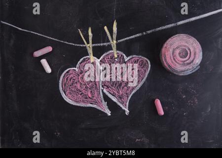 Done graphical representation with chalk on blackboard symbol of love, the heart Stock Photo