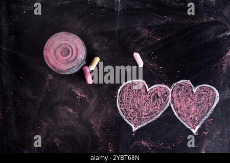 Done graphical representation with chalk on blackboard symbol of love, the heart Stock Photo