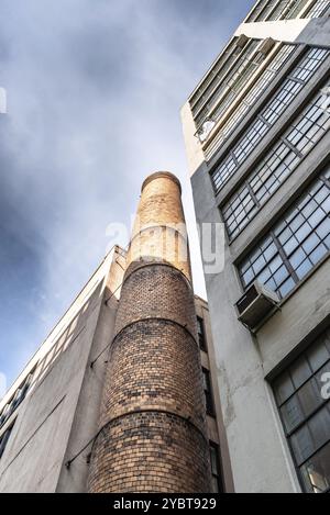 Low angle view of brick chimney of old industrial building in New York Stock Photo