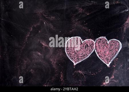 Done graphical representation with chalk on blackboard symbol of love, the heart Stock Photo