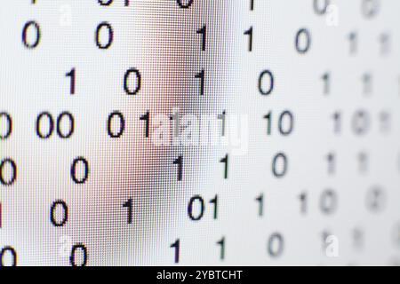 Binary code on a computer screen Stock Photo
