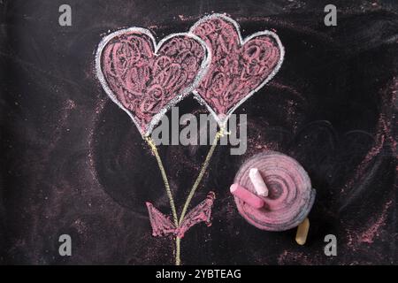 Done graphical representation with chalk on blackboard symbol of love, the heart Stock Photo