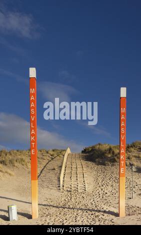 Orange coloured poles near the entrance to the Maasvlakte beach on the North Sea shore near Rotterdam Stock Photo