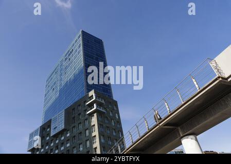 Bilbao, Spain, February 13, 2022: Isozaki Towers and Zubizuri footbridge in Bilbao. Low angle view against sky, Europe Stock Photo