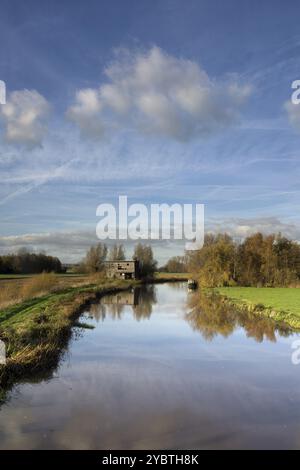 Old shed along the river Giessen near Hoornaar in the Dutch region Alblasserwaard Stock Photo