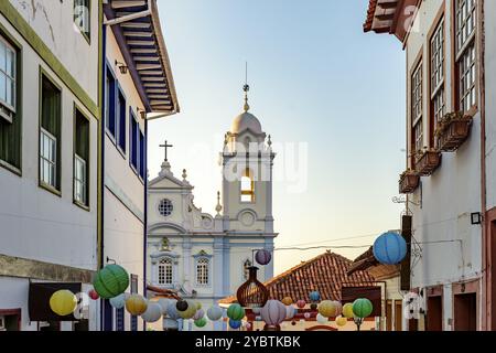 Houses and church in the streets of the city of Diamantina decorated with colorful lanterns and light fixtures Stock Photo