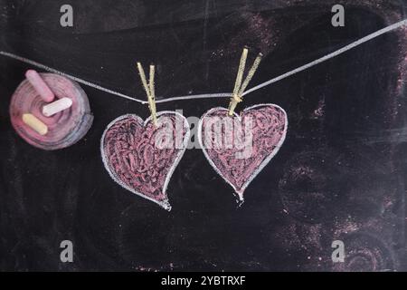 Done graphical representation with chalk on blackboard symbol of love, the heart Stock Photo