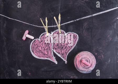 Done graphical representation with chalk on blackboard symbol of love, the heart Stock Photo