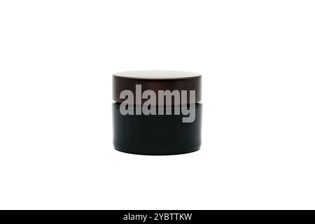 Black round cream skin care container, isolated on white background Stock Photo