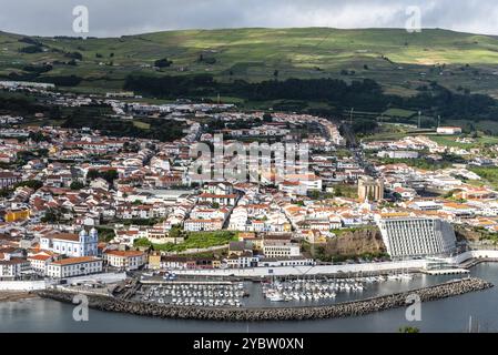 Angra do Heroismo, Portugal, July 1, 2022: Panoramic Aerial View of the old Town and the port of Angra do Heroismo from Monte Brasil, Terceira Island Stock Photo