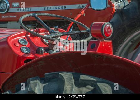 Steering Wheel and dashoard of a vintage red Massey Ferguson tractor Stock Photo