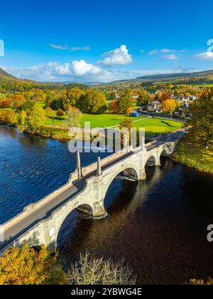 Aerial view from drone of General Wade’s Bridge in  village of Aberfeldy in autumn colours on River Tay, Perth and Kinross, Scotland UK Stock Photo