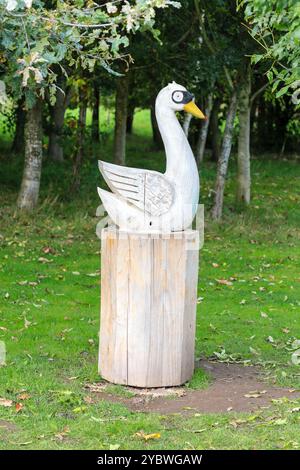 A wooden swan, part of The Stick Man Outdoor Trail at the National Memorial Arboretum, Alrewas near Lichfield, Staffordshire, England, UK Stock Photo