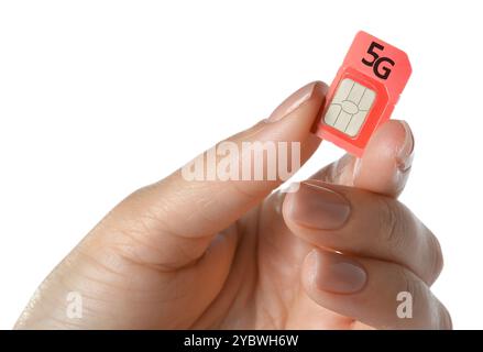 Woman with 5G SIM card on white background, closeup Stock Photo