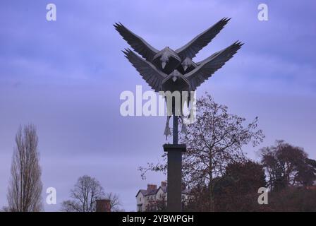 Three metal birds of prey. Statue, in Ross on Wye. Futuristic  design. Stock Photo