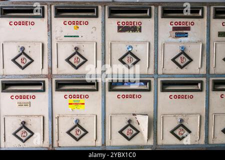 A row of vintage mailboxes in Bairro Alto, Lisbon, reflecting the city's unique urban architecture and history. Stock Photo
