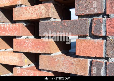 Perforated brick wall with mortar joints Stock Photo