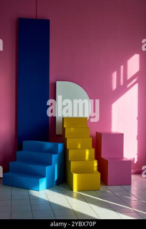 Colorful pencils arranged in a diagonal staircase pattern on a textured background. The vibrant hues create a rainbow-like effect, perfect for creativ Stock Photo