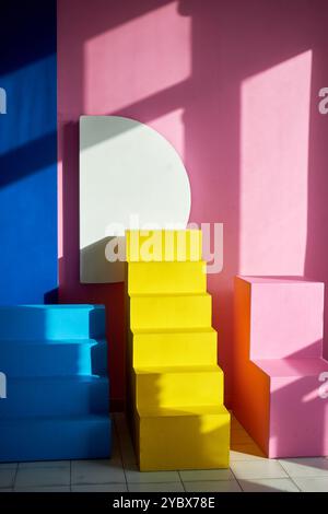 Colorful pencils arranged in a diagonal staircase pattern on a textured background. The vibrant hues create a rainbow-like effect, perfect for creativ Stock Photo