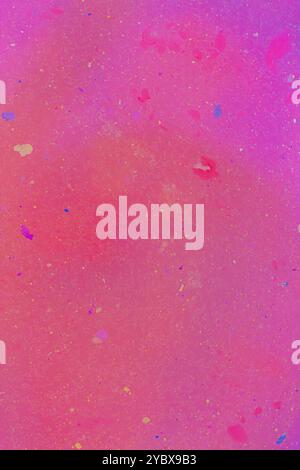 This image features a vibrant pink background with speckles of various colors scattered throughout, creating a glittery effect. Stock Photo