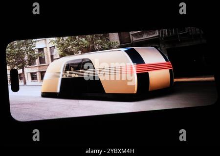 Shanghai,China-Oct.20th 2024:Tesla Robovan electric autonomous vehicle on phone screen Stock Photo