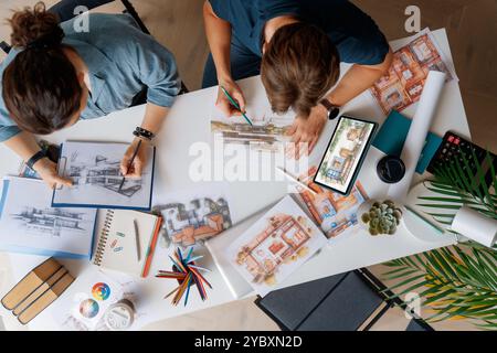 Designers working in studio and using sketches. Stock Photo