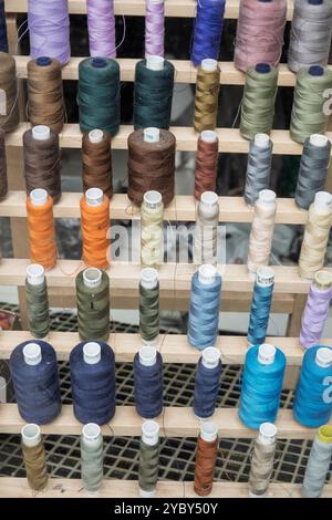 Reels of cotton thread in shop window Stock Photo