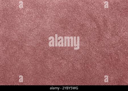 A closeup of a soft pink fabric with a textured surface and uniform pattern. Stock Photo