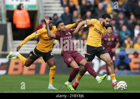 Wolverhampton, UK. 20th Aug, 2024. Savinho of Manchester City between Nlson Semedo and Rayan At-Nouri of Wolves during the Premier League match between Wolverhampton Wanderers and Manchester City Credit: MI News & Sport /Alamy Live News Stock Photo