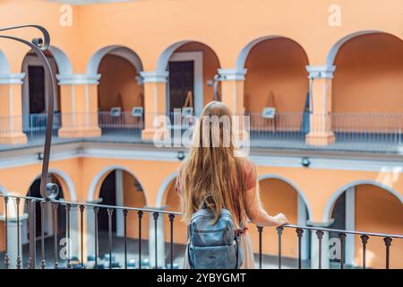 Female tourist in the Biblioteca Palafoxiana, Palafoxiana Library, Puebla, Mexico. Cultural exploration, history, and travel experience concept Stock Photo