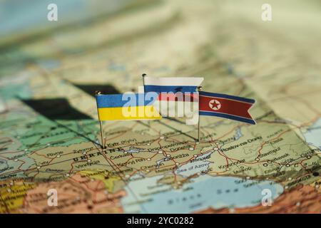 Ukraine, Kyiv - 2024 October 19: Ukraine, North Korea and Russia flags on Ukraine geopolitical map. North Korea fights on Ukraine lands Stock Photo