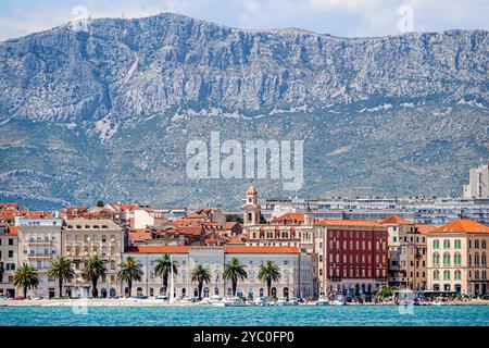 Split Croatia,Kastela Bay Adriatic Balkans Mediterranean Sea,Port of Split Luka,Riva Split Old Town waterfront promenade,city skyline buildings,Dinari Stock Photo