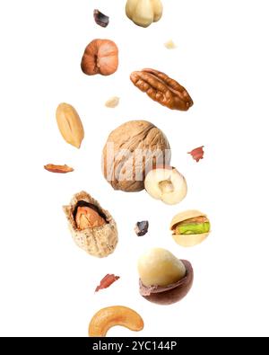 Macadamia and other nuts in air on white background Stock Photo