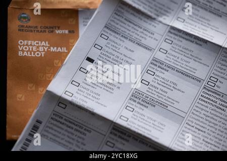Fullerton, California, USA - October 20, 2024: Filling out a vote by mail ballot in favor of Kamala Harris and Tim Walz for president. Stock Photo