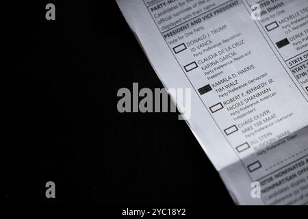 Fullerton, California, USA - October 20, 2024: Filling out a vote by mail ballot in favor of Kamala Harris and Tim Walz for president. Stock Photo