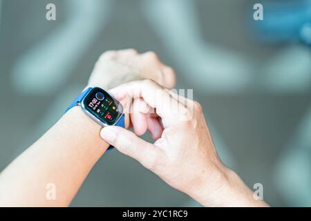 Woman pressing data on a Smartwatch, a Close Up Stock Photo