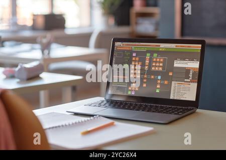 Background image of unrecognizable student building programming sequence on laptop during IT lesson in school or college copy space Stock Photo