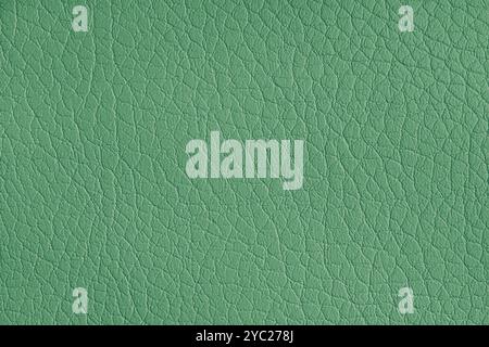 Texture of genuine leather or artificial synthetic leatherette green color. Skin structure close up, macro, Background, wallpaper, backdrop with copy Stock Photo