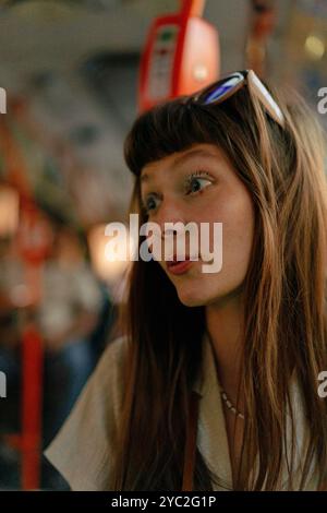 Young woman looking through window traveling by bus. Stock Photo