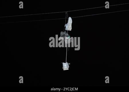Shoes hanging from Telephone Wire Stock Photo