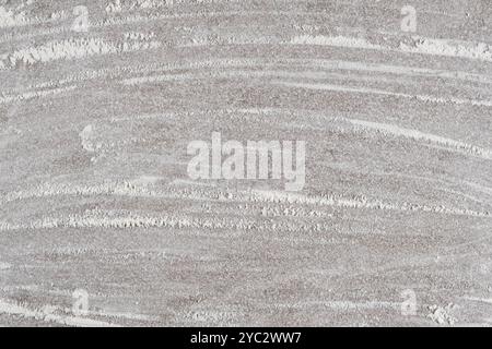 Grey cooking background of spilled wheat flour on stone background, top view. Stock Photo