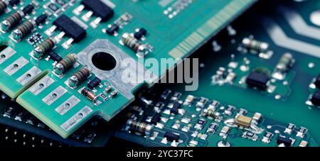 Close-up of a printed circuit board or PCB featuring wiring and microchip components. Advanced technology, precision engineering, and electronic hard Stock Photo