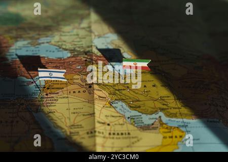 Iran and Israel flags on Middle east geopolitical map. Crisis and war between Israeli and Iran islamic republics. High quality photo Stock Photo