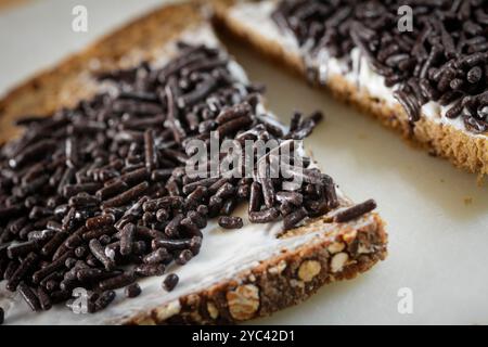 Slice of bread with hagelslaag. Typical Dutch bread topping for breakfast Stock Photo