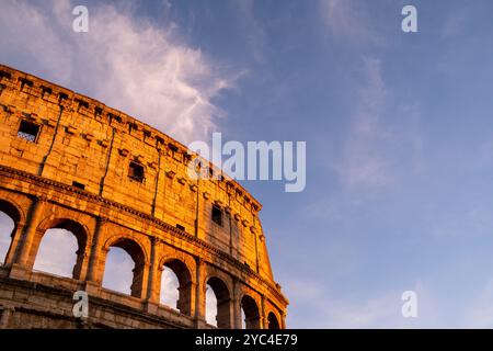 The Colosseum (Colosseo) at sunset, originally the Flavian amphitheatre (amphitheatrum Flavium), at sunset in the centre of the city of Rome, in the L Stock Photo