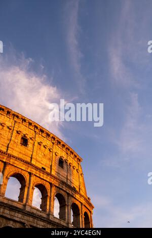 The Colosseum (Colosseo) at sunset, originally the Flavian amphitheatre (amphitheatrum Flavium), at sunset in the centre of the city of Rome, in the L Stock Photo