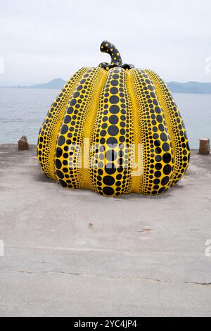 Giant Yellow Pumpkin Sculpture by Yayoi Kusama on the island of Naoshima in Japan Stock Photo