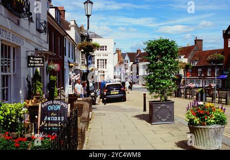 The High Street at Battle, East Sussex, UK, with shops and pedestrians Stock Photo