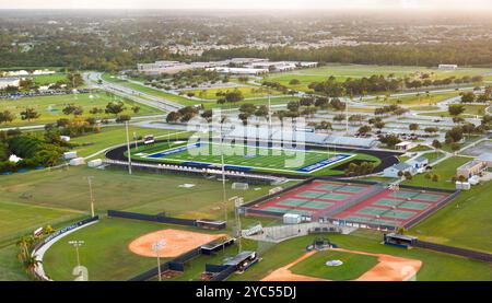 Public high school sports facilities in Florida. American football stadium, tennis courts and baseball diamond sport infrastructure. Stock Photo