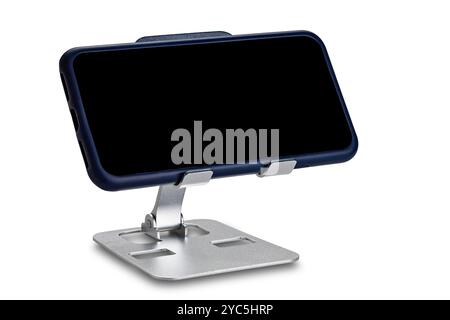 View of metal alloy adjustable phone holder with smartphone isolated on white background with clipping path. Stock Photo